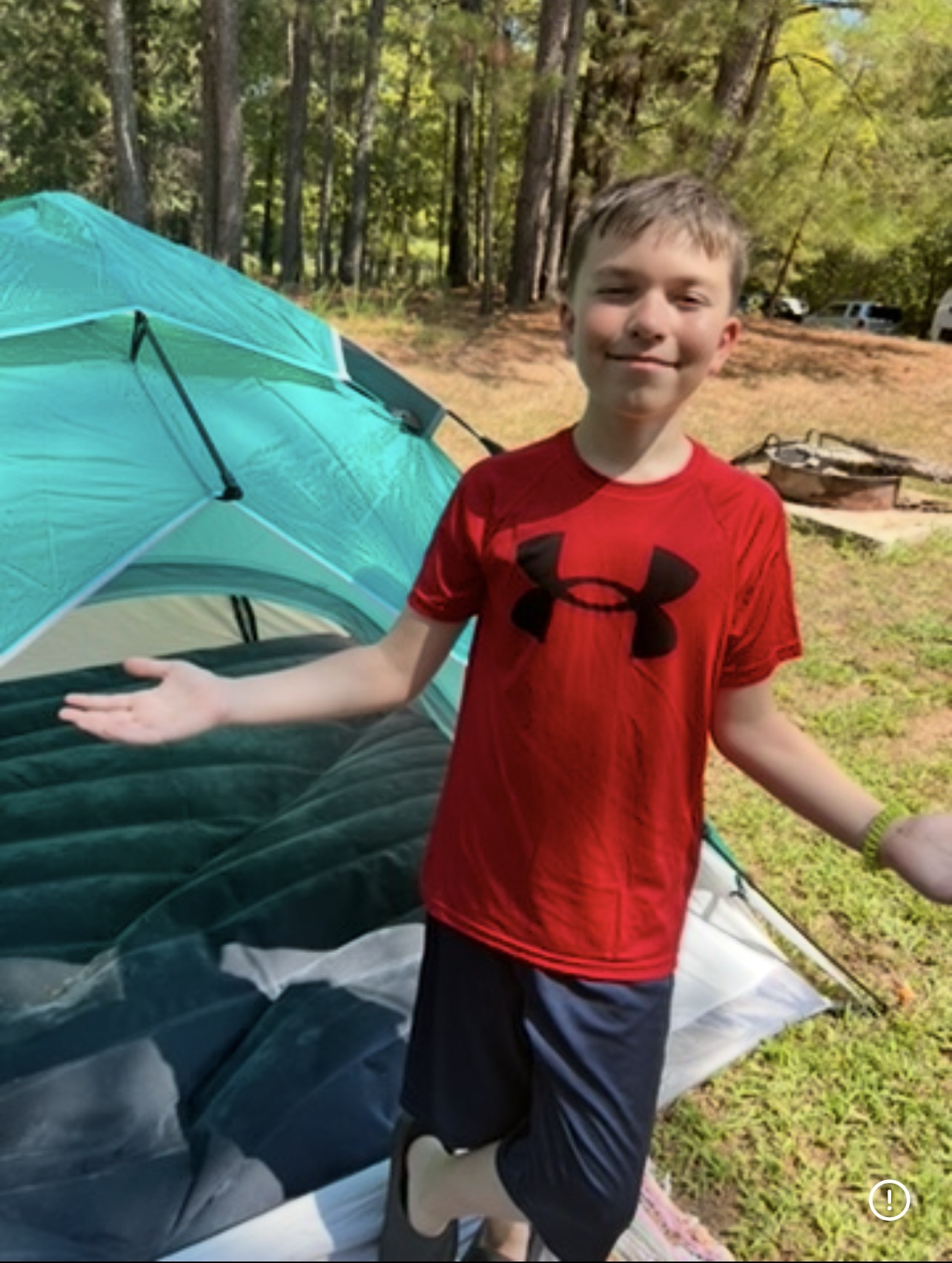 Kingston camping with his cousins in the woods