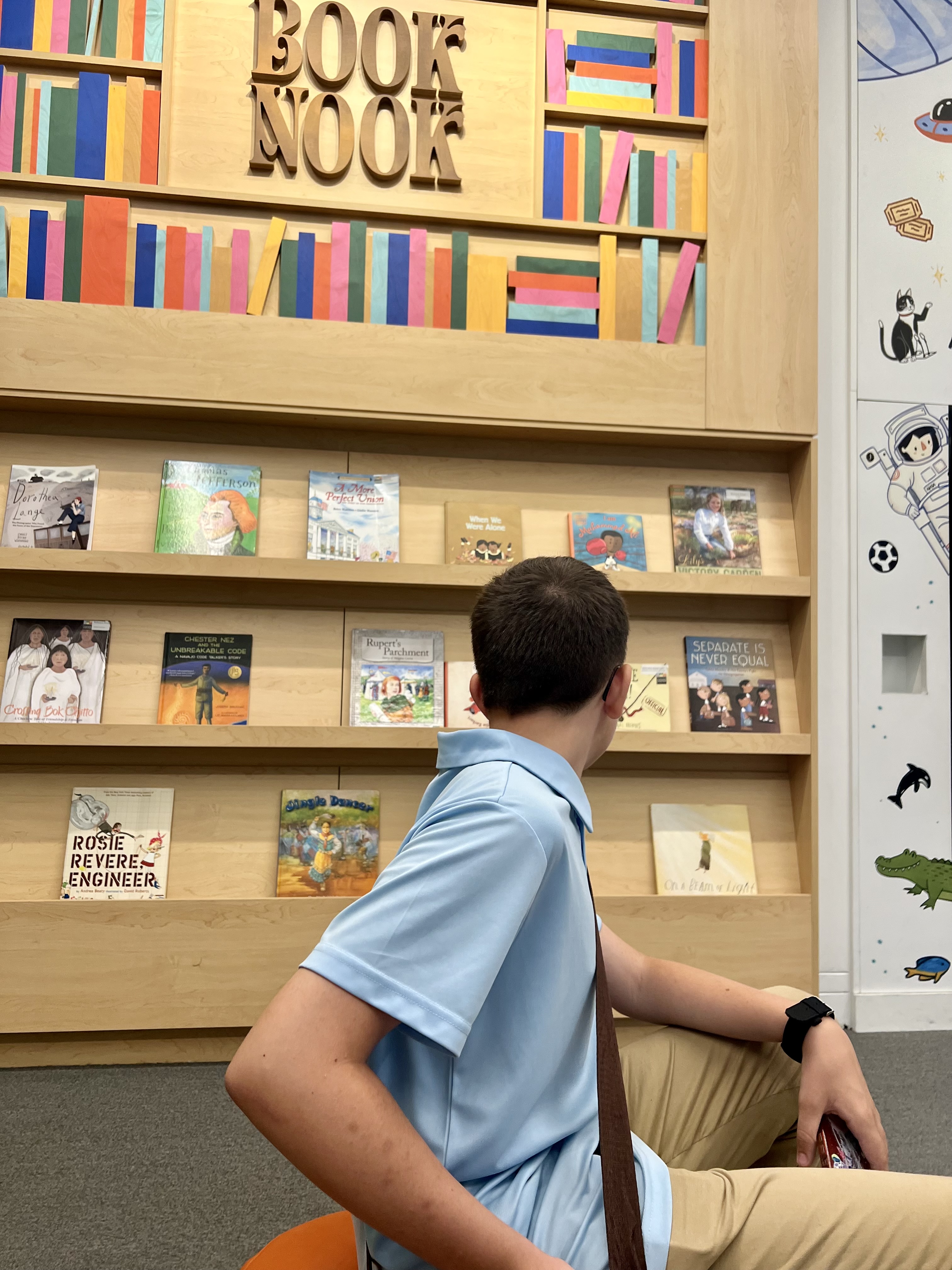 Kingston reading near the Book Nook at the National Archives